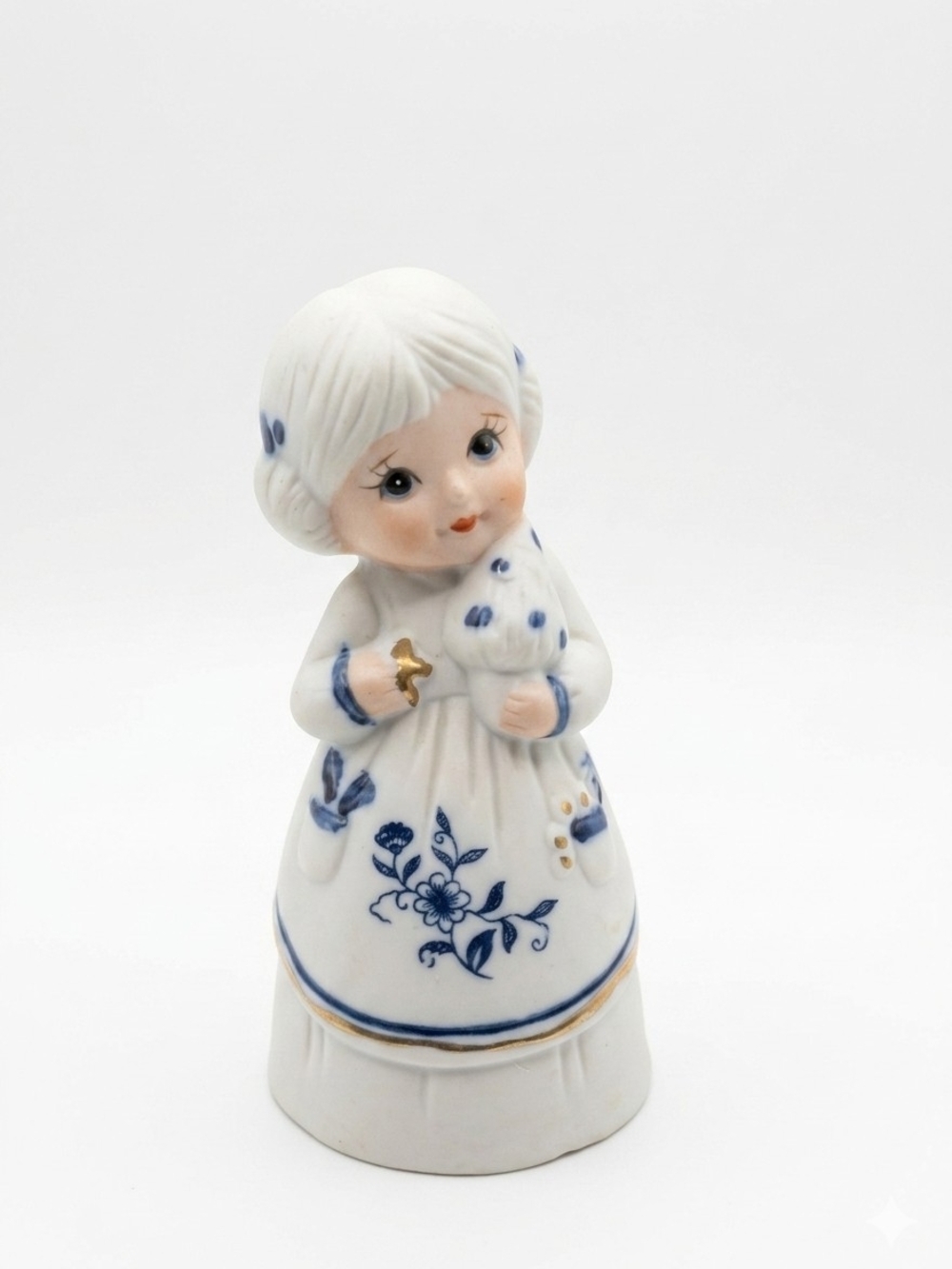 White Ceramic Girl Figurine with Blue Floral Detail and Gold Accent
